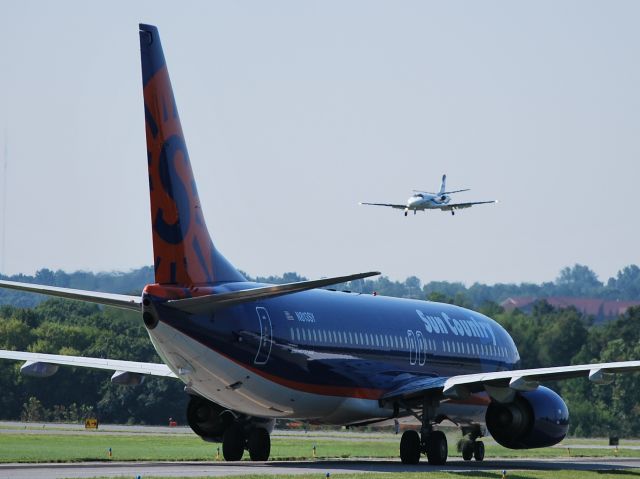 Boeing 737-800 (N813SY) - INTERNATIONAL LEASE FINANCE CORP (Sun Country - NASCAR flight) taxiing to runway 2 at KJQF - 8/16/12