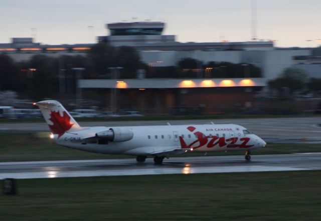 Canadair Regional Jet CRJ-200 (C-GNJA) - As JZA7925 rolls down runway 18C a tornado touches down on the other side of Charlotte NC.