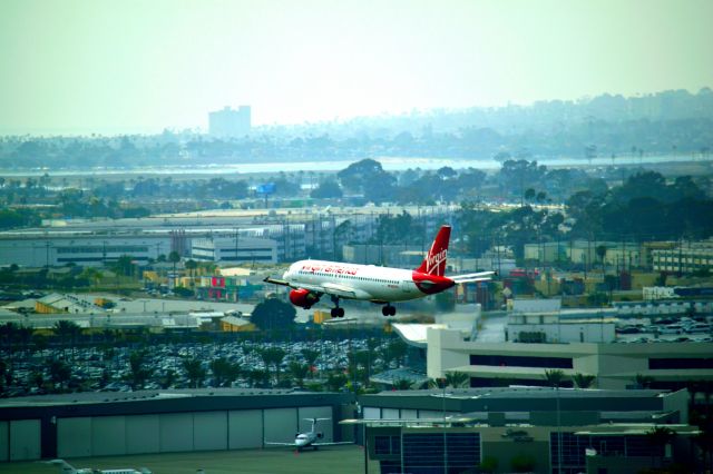 Airbus A320 (N633VA) - Virgin America coming in to San Diego, 2016.  Photo taken from my balcony of the Double Tree Downtown. 