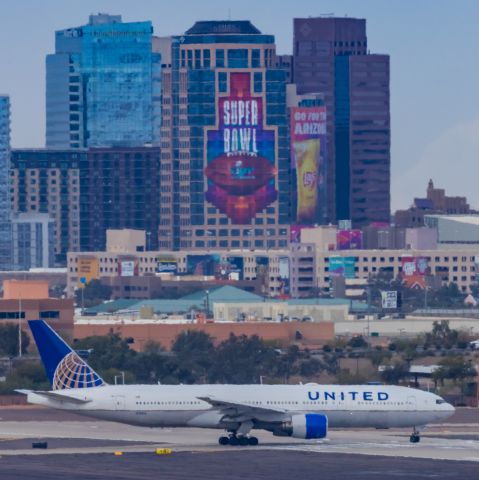 Boeing 777-200 (N768UA) - A United Airlines 777-200 taxiing at PHX on 2/13/23, the busiest day in PHX history, during the Super Bowl rush. Taken with a Canon R7 and Canon EF 100-400 II L lens.