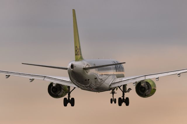 Airbus A220-300 (YL-AAT) - 12th May, 2024: Flight BT 424 from Zurich crossing the "piano keyboard" threshold of runway 15 at Birmingham International Airport. 