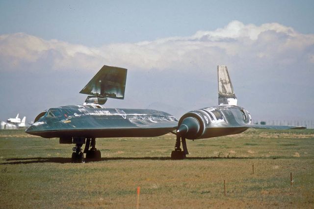 60-0924 — - Lockheed A-12 60-0924 at the future site of Blackbird Airpark in Palmdale on May 1, 1991. It still carries remnants of protective spray-on latex coating. Some parts of the airframe were still unpainted titanium. The Space Shuttle Endeavor can be seen on 747 Shuttle Carrier Aircraft N911NA in the background. Endeavors delivery flight to the NASA Kennedy Space Center had been postponed until the following day.