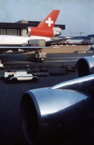 McDonnell Douglas DC-10 (HB-IHO) - Photo taken from inside SIA 747 9V-SQQ in 1984 at Zürich-Kloten