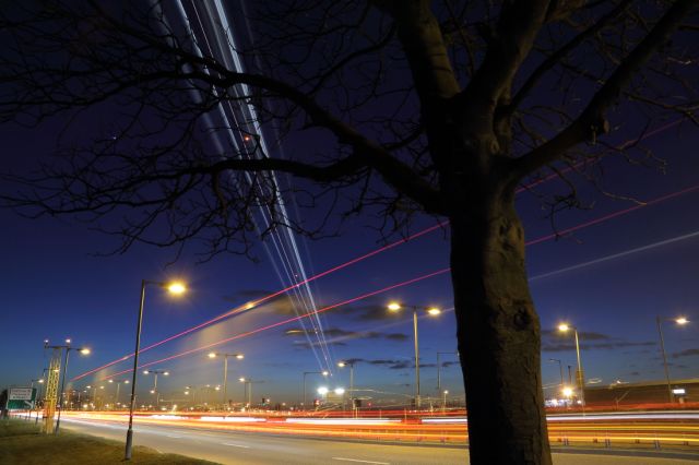 Airbus A320 — - Long time exposure of A320 flying over the A30 as it approaches runway 027L at LHR.