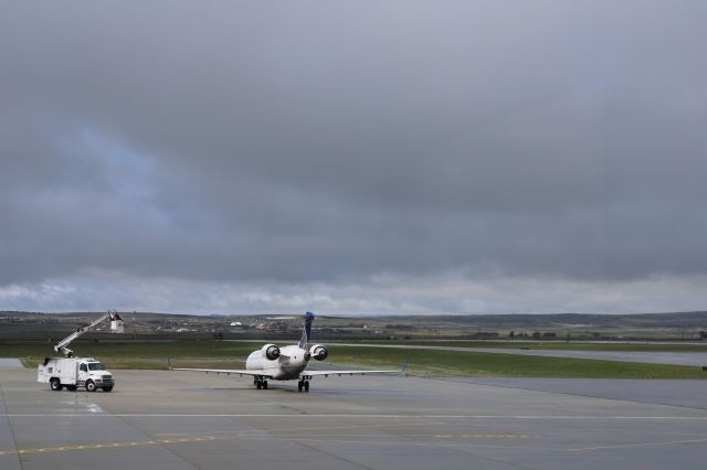 Canadair Regional Jet CRJ-700 (N156GJ) - From the observation deck at KCPR deicing