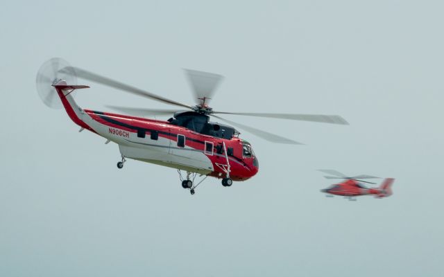 N906CH — - A CHI helicopter departs Ellington Field for a construction project while the Coasties come cruisin in with their HH65.