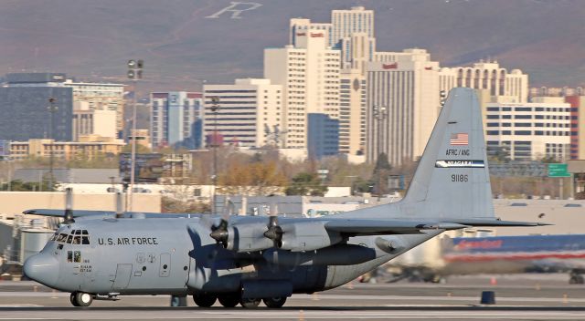 Lockheed C-130 Hercules (89-1186) - The last of a four-ship "Roller Flight" group making a morning departure, this Hercules (89-1186), on loan to the 152nd AW from the New York Air Guard, approaches rotation speed as it rolls down runway 16R.