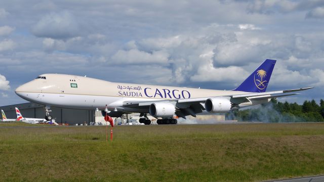 BOEING 747-8 (HZ-AI4) - BOE572 touching down on runway 34L to complete a flight test on 6/13/13. (LN:1432 cn 37563).