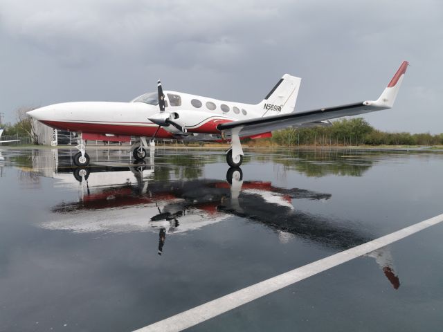 Cessna Chancellor (N569PA) - Rainy day, just released from paint shop job! Proud pilot of this beauty