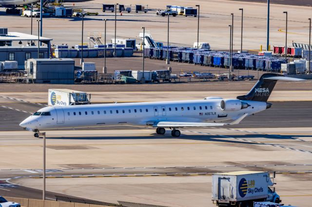 Canadair Regional Jet CRJ-900 (N957LR) - A Mesa Airlines CRJ900 taxiing at PHX on 2/9/23 during the Super Bowl rush. Taken with a Canon R7 and Tamron 70-200 G2 lens.