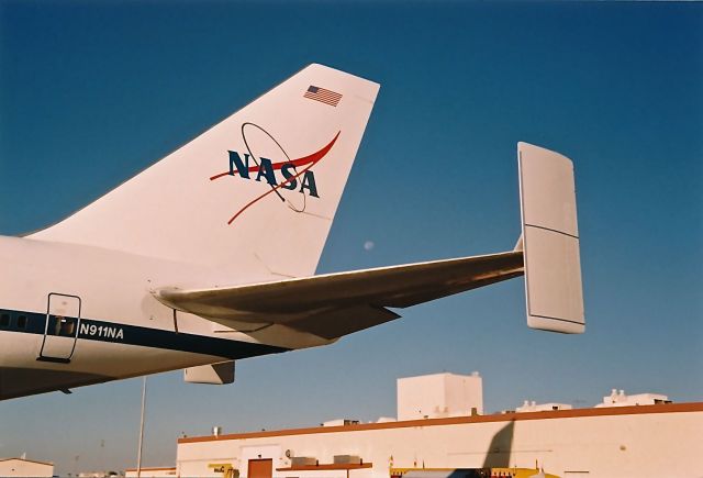 Boeing Shuttle Carrier (N911NA) - The tail of NASA Shuttle B-747 framing the moon. The aircraft was on display at the Edwards AFB Open House and Air Show 10-18-1997