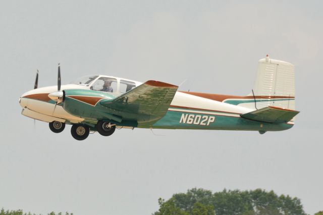 Beechcraft Twin Bonanza (N602P) - 2021 AirVenture departure.