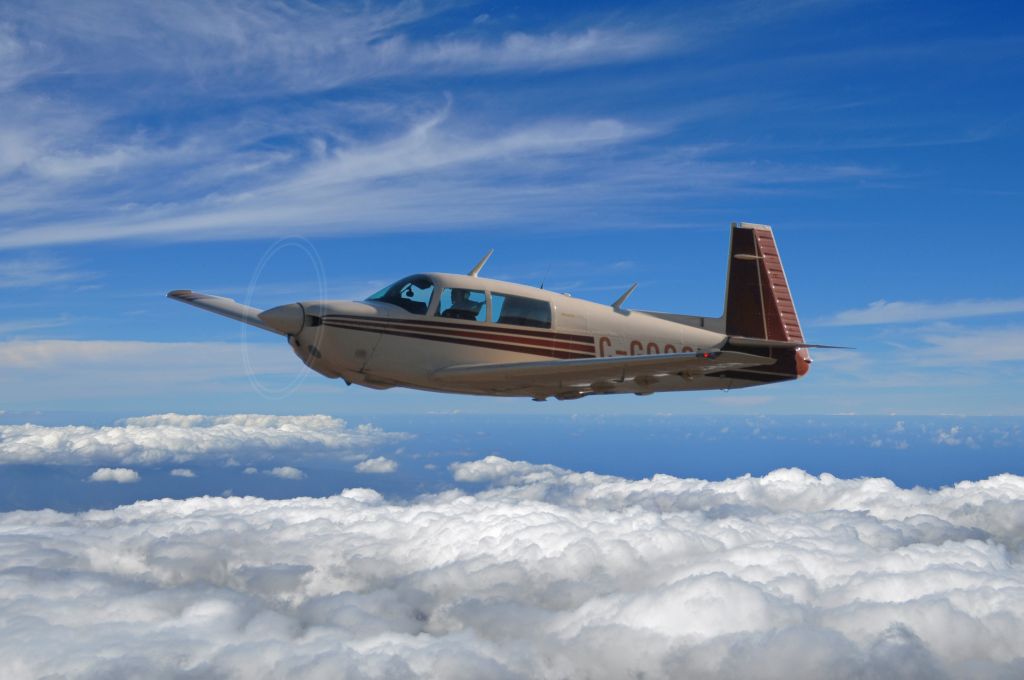 Mooney M-20 (C-GQQQ) - This was taken from 100 AGL. Aircraft flew down runway in side slip and was later photo shopped.