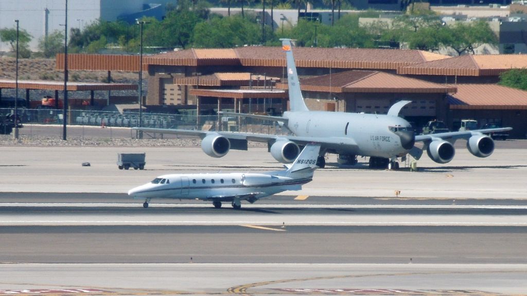 Cessna Citation Excel/XLS (N612QS) - A NetJets Citation in front of a KC-135 at Sky Harbor.