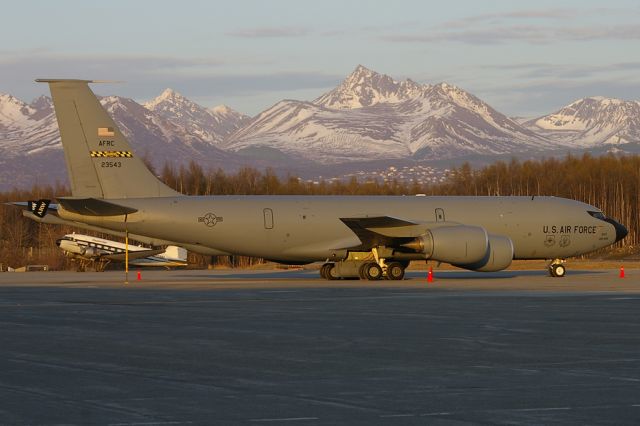 N623543 — - Far from its home of Andrews AFB is this USAF/AFRC KC-135R. Aircraft seen during the days last rays of sunshine with the Chugach Mountains and a Desert Air DC3 in the background.