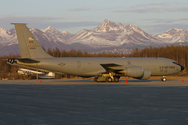 N623543 — - Far from its home of Andrews AFB is this USAF/AFRC KC-135R. Aircraft seen during the days last rays of sunshine with the Chugach Mountains and a Desert Air DC3 in the background.