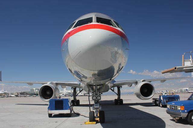 Boeing 757-200 (N650AA) - While being repositioned at the gate by a tug at DIA, this pretty girl struck the jetway with its port engine. You can see the damage to the nacelle and engine mount.