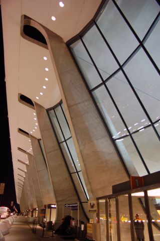 — — - The massive size of the Dulles terminal becomes evident when youre standing under it