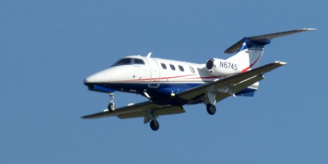 Embraer Phenom 100 (N6745) - On short final is this 2009 Embraer Phenom 100 in the Spring of 2023.