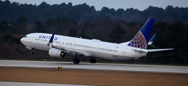 Boeing 737-900 (N38479) - A nice 739 wheelie for you.  Off to ORD, taken on the RDU observation deck, 12/23/17
