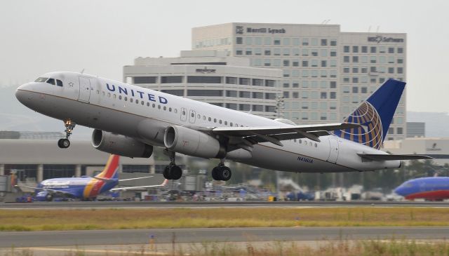 Airbus A320 (N416UA) - N416UA departing runway 2L on an overcast morning. The wind was calm and the usual calm wind runway is 20R for jet traffic but SNA has a very short runway and sometimes flights are too heavy to takeoff on 20R but going the other direction on the same runway (2L) there is enough of an up-slope which creates lift faster and they are able to get up in time,even going this direction this one still took up most of the runway.  