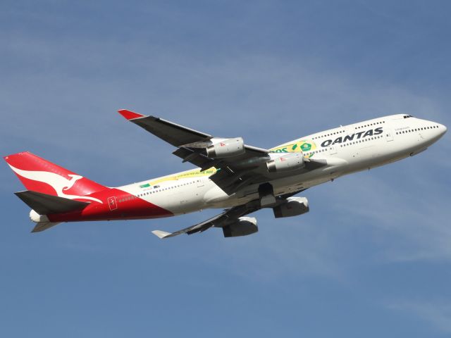 Boeing 747-200 (VH-OJS) - Qantas B747-400 departs runway 09R at LHR, sporting the Socceroo's World Cup Special Livery.
