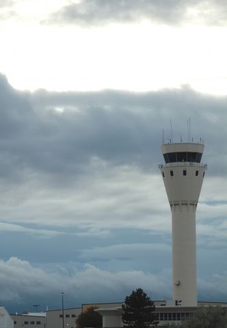 — — - Tower at KAPA, looking west toward the storms.