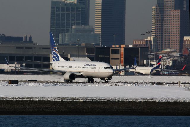 Boeing 737-800 (HP-1843CMP) - South American carriers in the snow - Copa departing BOS while Latam arrived earlier sits at the gate. 