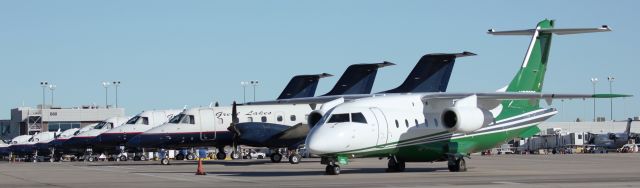 Fairchild Dornier 328JET (N259DS) - Key Lime Dornier in front of a bunch of Great Lakes Embraers and Beechcrafts.