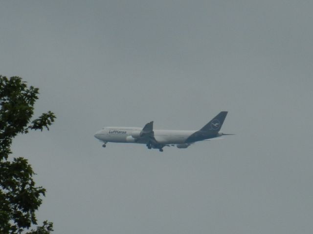 Boeing 747-400 (D-ABVM) - D-ABVM, A Boeing B747-400 Of Lufthansa In The New Livery Puts Her Gear Down While Approaching Dulles International Airport, D-ABVM Is Currently The Only Lufthansa B747-400 In The New Livery