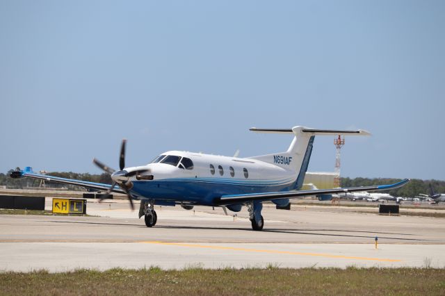 Pilatus PC-12 (N691AF) - Pilatus PC-12 (N691AF) taxis to customs at Southwest Florida International Airport following flight from Leonard Thompson Airport