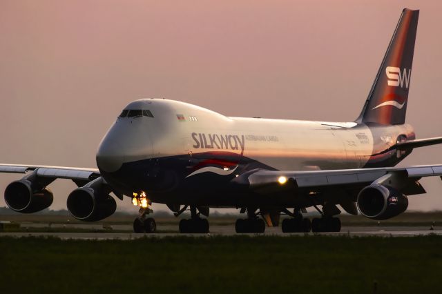 BOEING 747-8 (4KSW800) - In sunset.