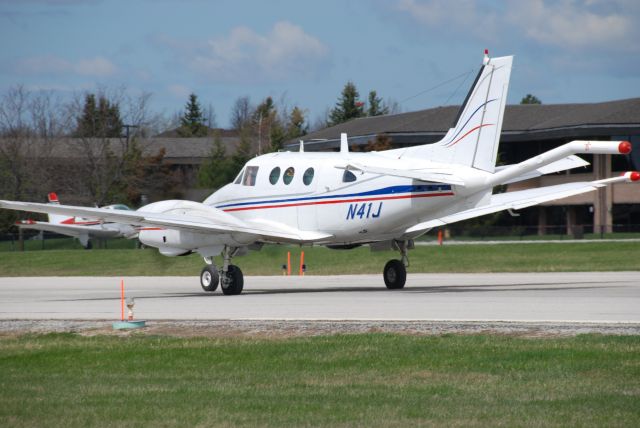 Beechcraft King Air 90 (N47J) - N41J getting work done at YKZ before heading off to South America for geo-surveying.  April 18/10