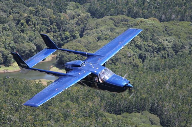 Cessna Super Skymaster (VH-OIQ) - Cessna 337 over rainforest in Far North Queensland, Australia