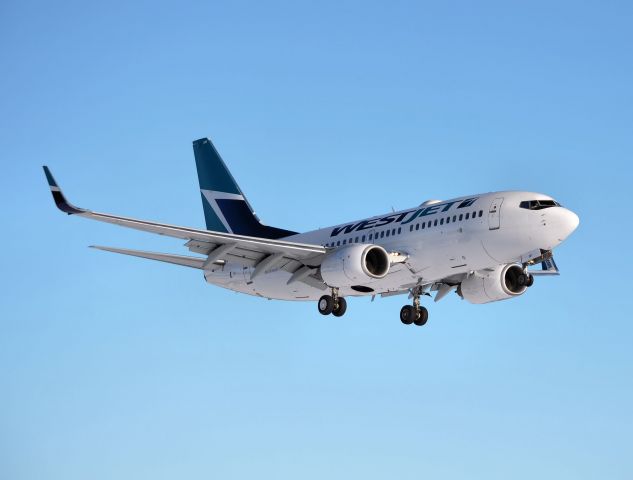 Boeing 737-700 (C-GVWJ) - Arriving from Montego Bay, photo taken 17-Feb-14.