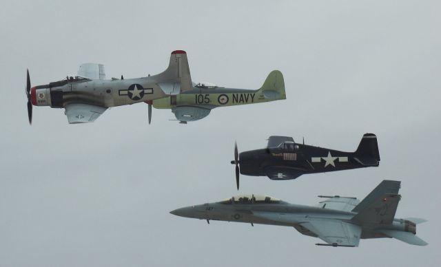 — — - A-1H Raider, Seafury, F6F Hellcat, FA-18F Navy Heritage flight at the 2006 Nellis AFB show.