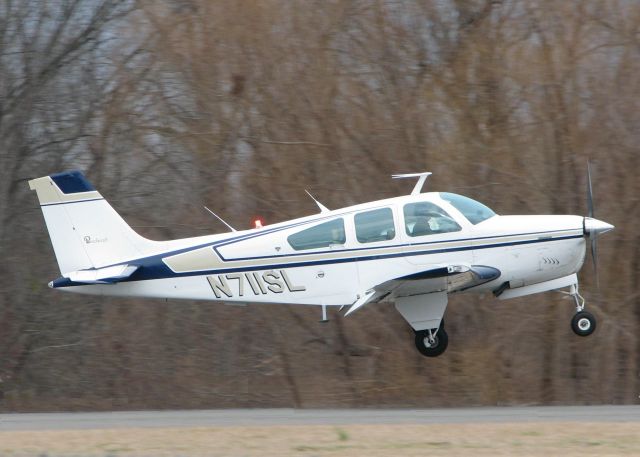 Beechcraft Bonanza (33) (N711SL) - Touching down at Downtown Shreveport.