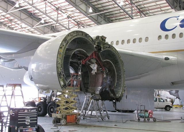 Boeing 777-200 (N27015) - 777 receiving an engine change at the Continental Maintenace Center at EWR.