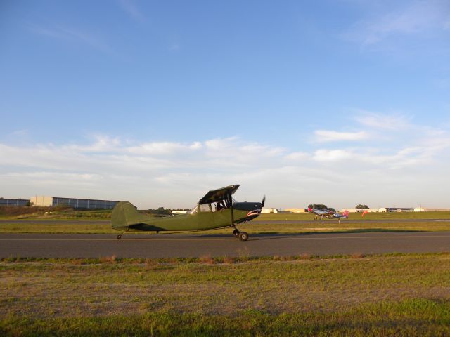 Cessna 206 Stationair (N5269G) - N5269G, banner tow plane, taxiing at BLM with P-51 in background.