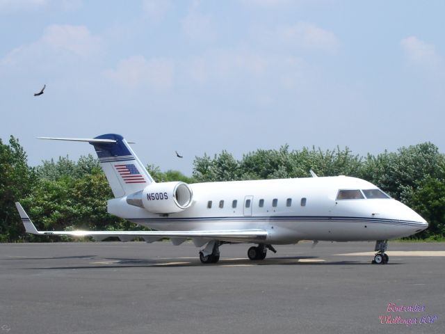 Bombardier Global 5000 (N50DS) - Even the Hawks are enjoying this winged machine.
