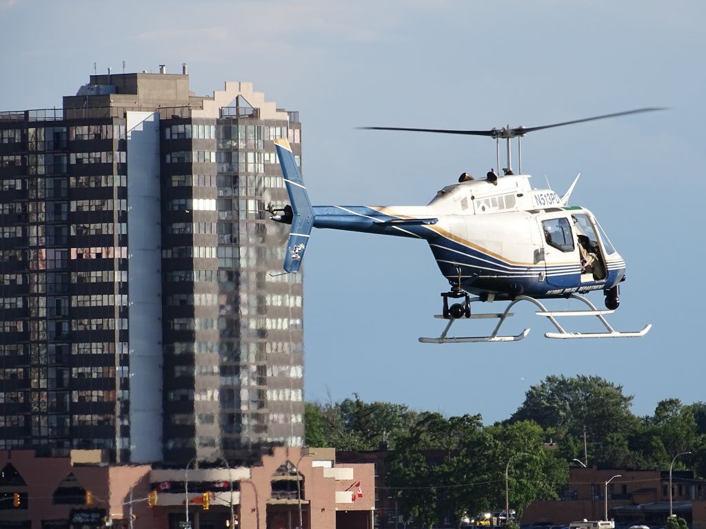 Douglas A-26 Invader (N513PD) - This helicopter was flying over Detroit, Michigan. I shot this picture while standing on the Central (Miller) Parking Garage on June 26, 2017 while attending an event for the Ford Fireworks.