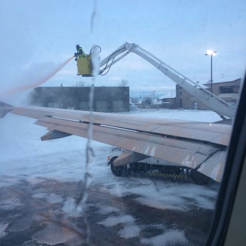 Airbus A320 (N320US) - Delta Airline Ground Operations - Deicing before departure from BZN to ATL on Sun 17 Jan 2016, photo from seat 21A, A320, N320US