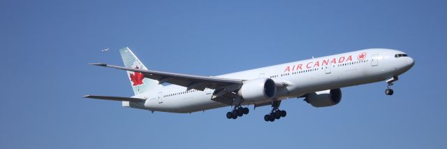 BOEING 777-300 (C-FIVQ) - British Airways G-ZBKB  B787 in the background