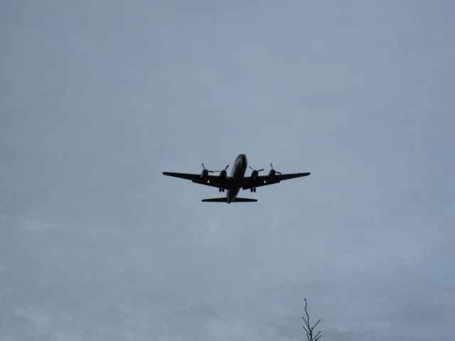 Douglas DC-6 — - Dc-6 landing at Fairbanks.