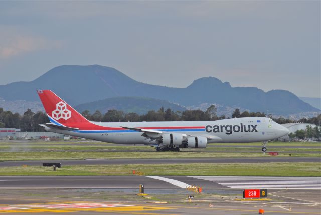BOEING 747-8 (LX-VCN) - Boeing B747-8R7F LX-VCN MSN 38076 of Cargolux "Named Spirit Of Schengen" is caught in the touchdown onto the 023L runway at Mexico City International Airport (08/2019).
