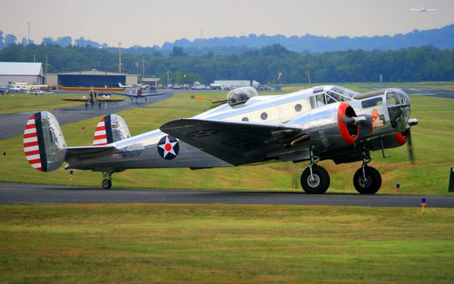 N7337C — - 1943 Beech AT-11 taxing to runway 19 after participating in a fly-in sponsored by the EAA at M54.