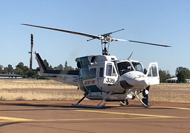 Bell VH-1 (VH-JJK) - Parked outside the Qantas hanger on the 14/07/2018, the crew of this Bell 212 were doing their final checks prior to taking off