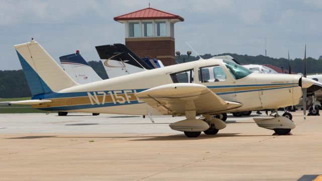 Piper Cherokee (N715FL) - Cute little Cherokee resting amongst a ramp full of various piston airplanes.