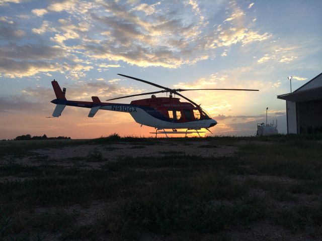 Bell 407 (N910GX) - Med Evac helicopter on the pad outside its hangar