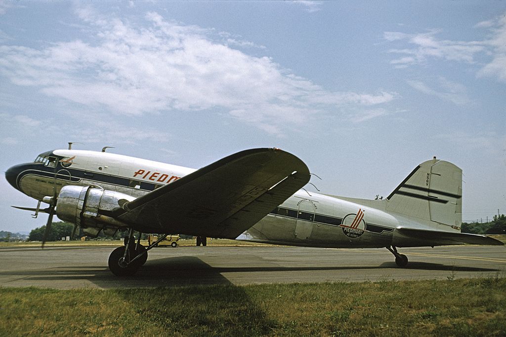 Douglas DC-3 (N56V) - N56V was manufactured in 1944 for the US Military as a C-53-DO with serial number 4900.  It was later sold to Western Airlines and registered as NC18600.  In January 1956 it was purchased by Piedmont Airlines and named the Potomac Pacemaker with the registration changed to N56V.  It was removed from service in February 1963 and sold to Charlotte Aircraft to be used for spare parts and soon became a derelict.  In 1978 it was purchased by the North Carolina Nature Museum in Durham, NC and with the assistance of Piedmont was partially restored and displayed outdoors at the museum on pylons.   In 2004 it was purchased by the North Carolina Transportation Museum in Spencer, NC where it is now being restored by volunteers. Plans are to have it completed and ready for static display on Piedmont’s 70th anniversary in February 2018. Photo from the archives of the Piedmont Aviation Historical Society with permission of US Airways {American}.